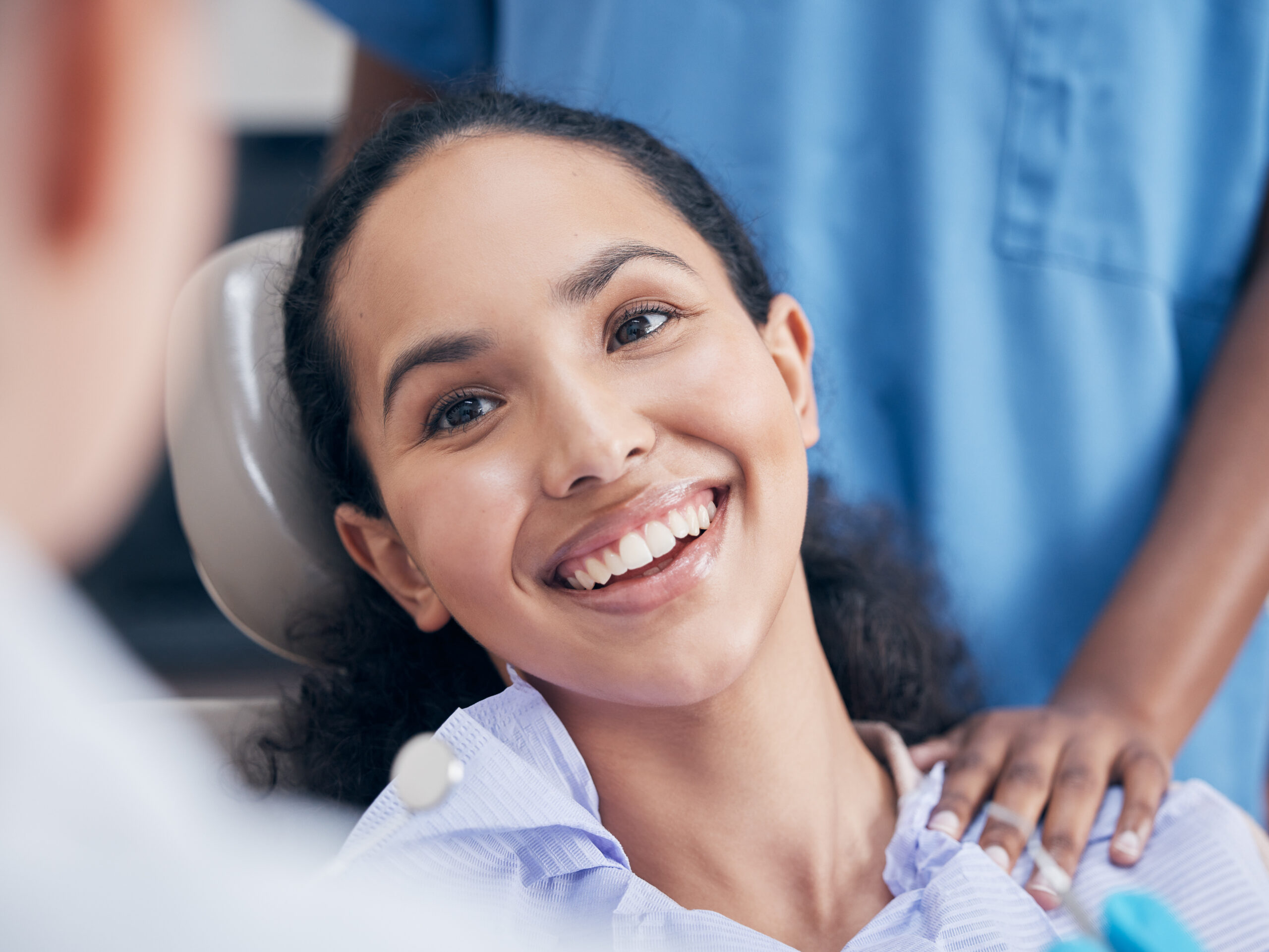 Her smile lights up a room. Shot of a young woman visiting her dentist for a checkup